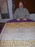 Tai Shogi: player's eye view. Tongs are used to reach across the board.